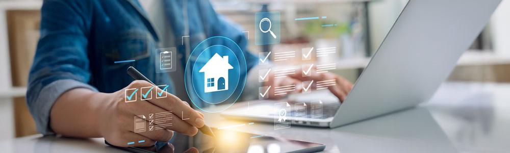 Person on laptop signing contracts