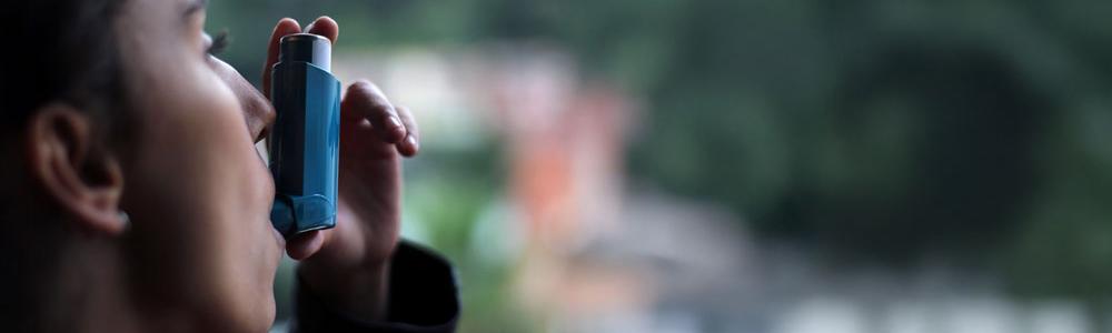 Woman using inhaler