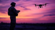 Silhouette of a solider operating a drone