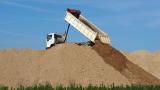 Dump truck depositing soil