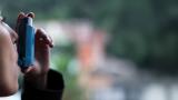 Woman using inhaler