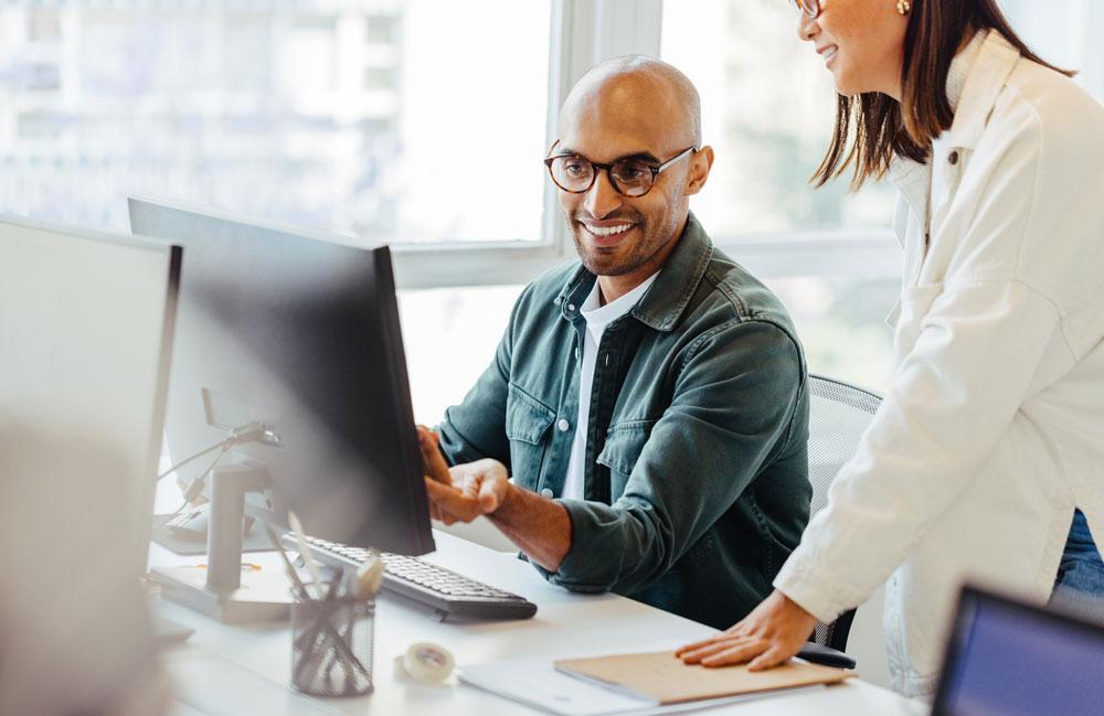 People collaborating on computer