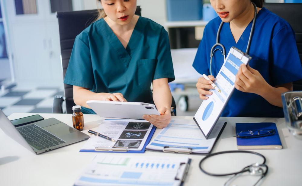 Healthcare workers using tablet