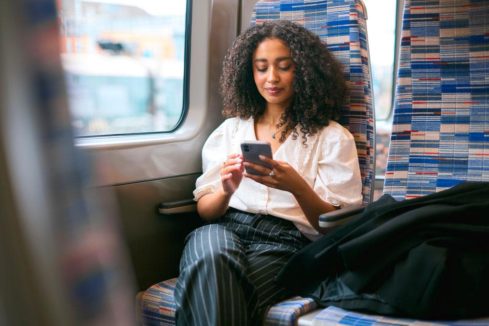 Person on phone on train